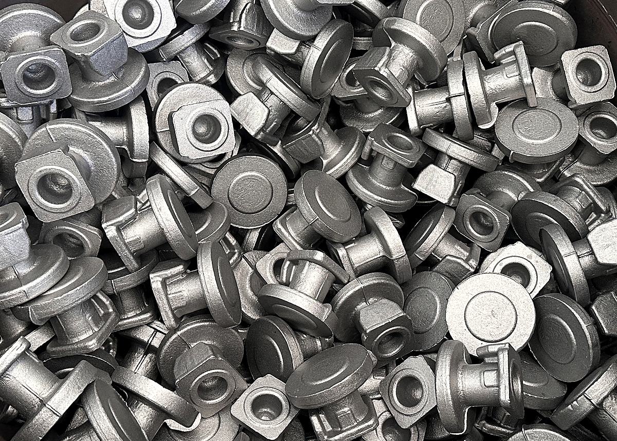 A bin of blasted forged ball valve blanks.