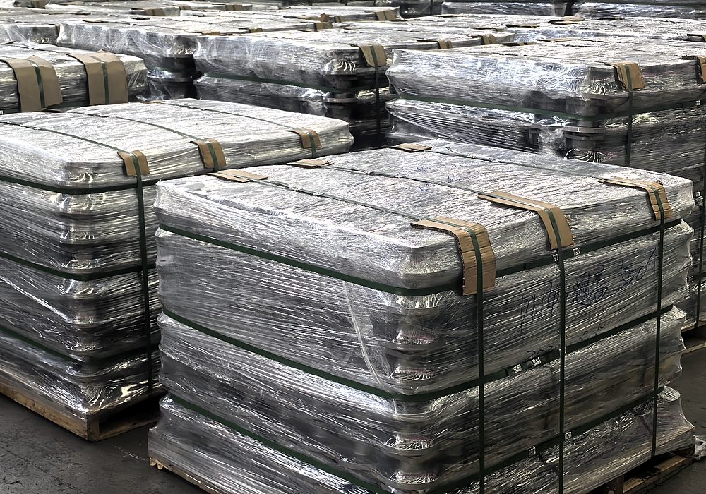 Forged blanks strapped and wrapped on pallets, ready for export.